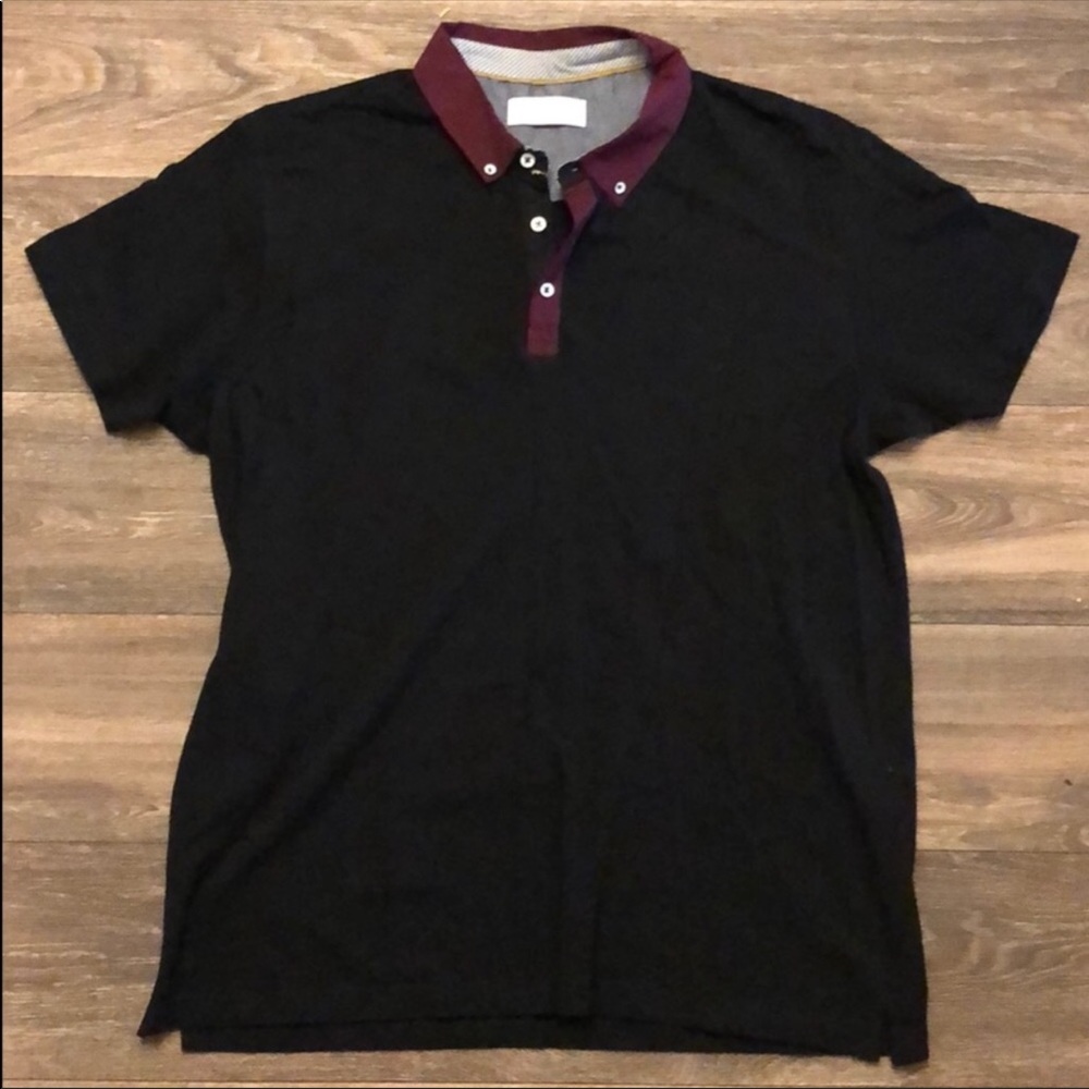 Black polo style shirt.